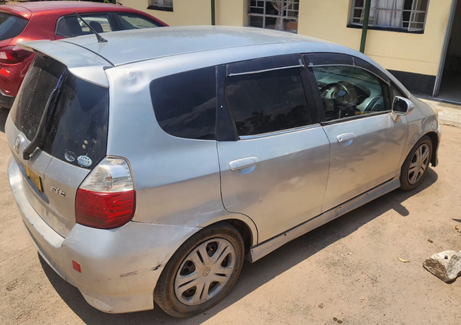 PoliceZimbabwe's tweet photo. The ZRP confirms the arrest of Precious Ibu (18) in connection with a case of theft of a Honda Fit vehicle at a bar in Marondera around 0100 hours on 18/10/2026. Police investigations and follow-ups led to the recovery of the vehicle at a club in Dombotombo, Marondera, where the suspect was found sleeping inside. He attempted to flee upon sensing danger but was arrested. The vehicle was recovered and returned to its owner.