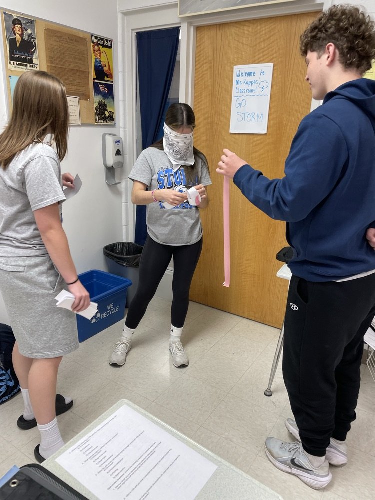 BVHS340's tweet photo. Students in Driver's Ed. working on overcoming obstacles to build the longest paper chain with Mrs. Stoller. https://t.co/p8CnD3jyUR