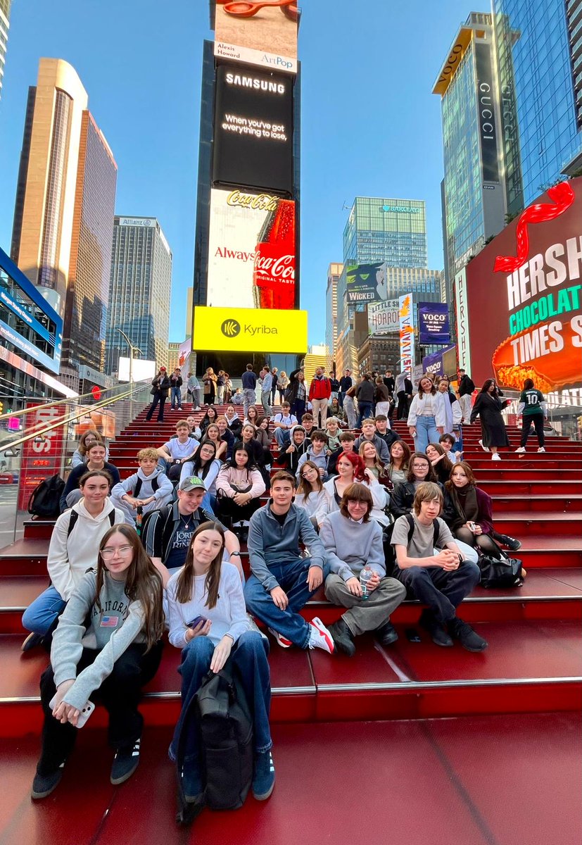 BourneAcademy's tweet photo. Day Two in New York – Times Square!

40 of our Year 11 students are enjoying an incredible six-day trip to New York City to round off the half term.

Day two has taken them to the bright lights of Times Square, where they stopped for a group photo on the iconic red steps! https://t.co/SlyxtPHErH