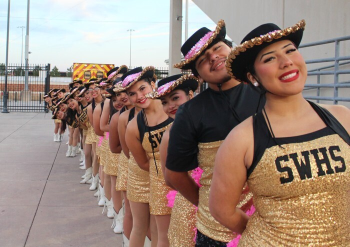 SpringWoodsHigh's tweet photo. 12th grade yearbook photographer Edgar Sanchez Roque took these photos of the SWHS Tigerettes and Color Guard at the last varsity football game. You will see his photos in the yearbook! Please order yours now at https://t.co/YOGczUTtbv! https://t.co/xciVde4SRa