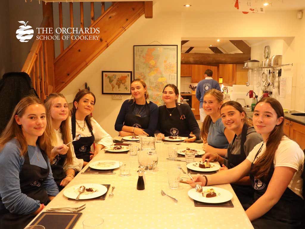 OrchardsCookery's tweet photo. A little rain outside, plenty of cooking inside! 🌧👩‍🍳  Our Chalet Cooks and Orchards Course Students have made crispy Paneed Turkey, golden Baked Camembert and gooey Chocolate Moelleux. 😋 Not a bad way to spend a rainy day! ☺️ https://t.co/Rmjqfj9ugN