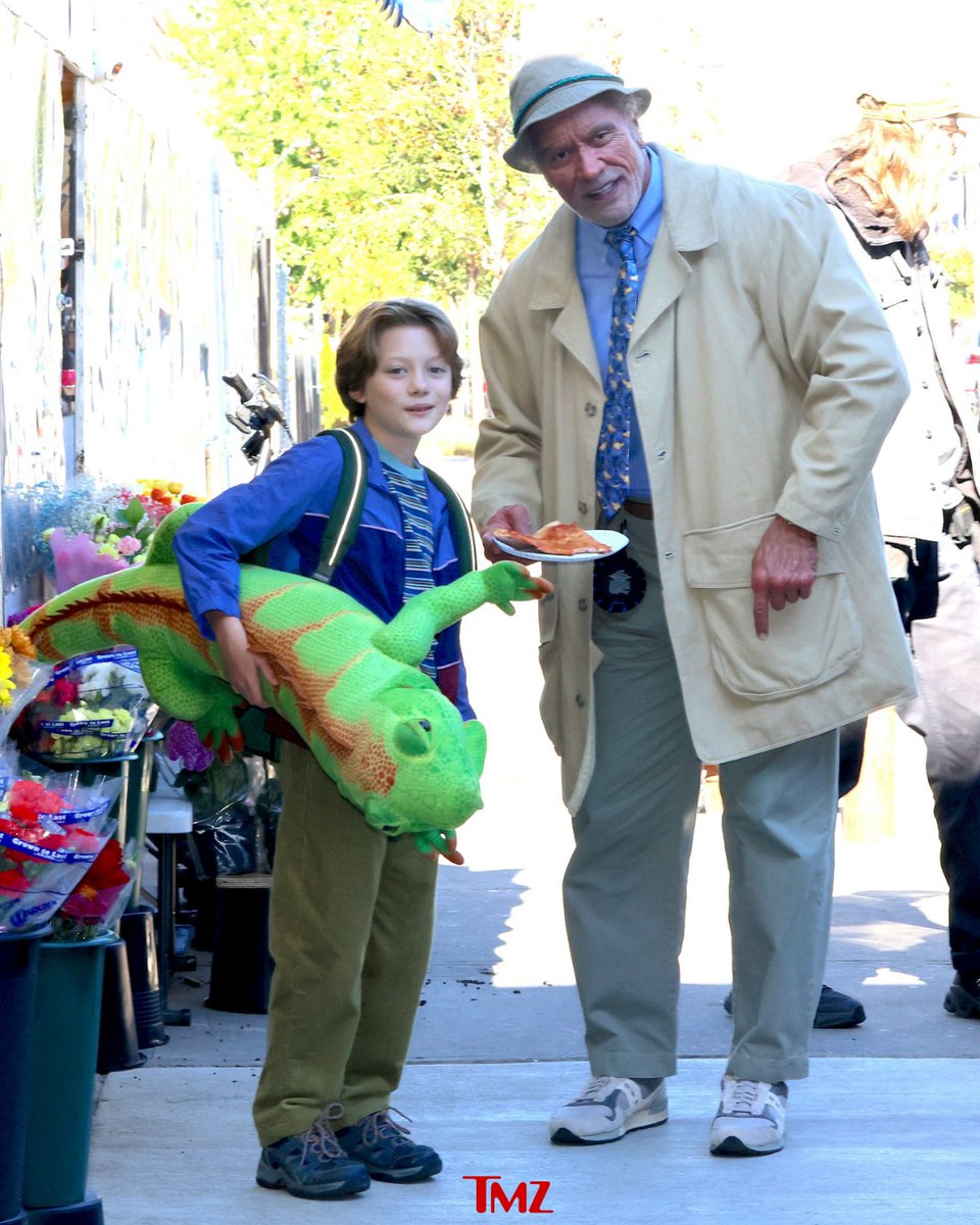 TMZ's tweet photo. 🦎🎶 Dwayne Johnson rocks a new look in New York City alongside child actor Theo Liber on the set of his upcoming film "Lizard Music."

📷: Getty https://t.co/WLbBP2H48v