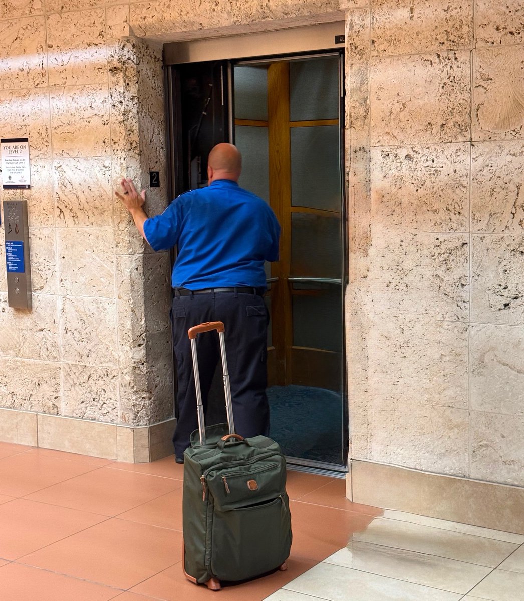 TSA's tweet photo. A TSO at DJT Airport in Florida stepped up when an airport employee got trapped in an elevator, prying open the doors and alerting airport operations.  

Proud to have him on our team! 

Full story: https://t.co/KLma2VhPvy https://t.co/qXGmXb5lun