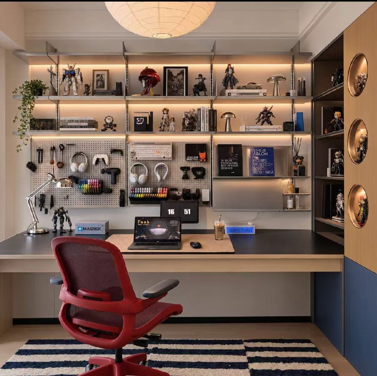 MrRaviK0's tweet photo. Warm lighting, a pegboard full of gear, and shelves with personality. ☕💻

This setup makes a strong case for a workspace that feels cozy and personal.

What catches your eye first—the lighting, the display shelves, or the red chair? 👇 https://t.co/g1IZpSfDlm