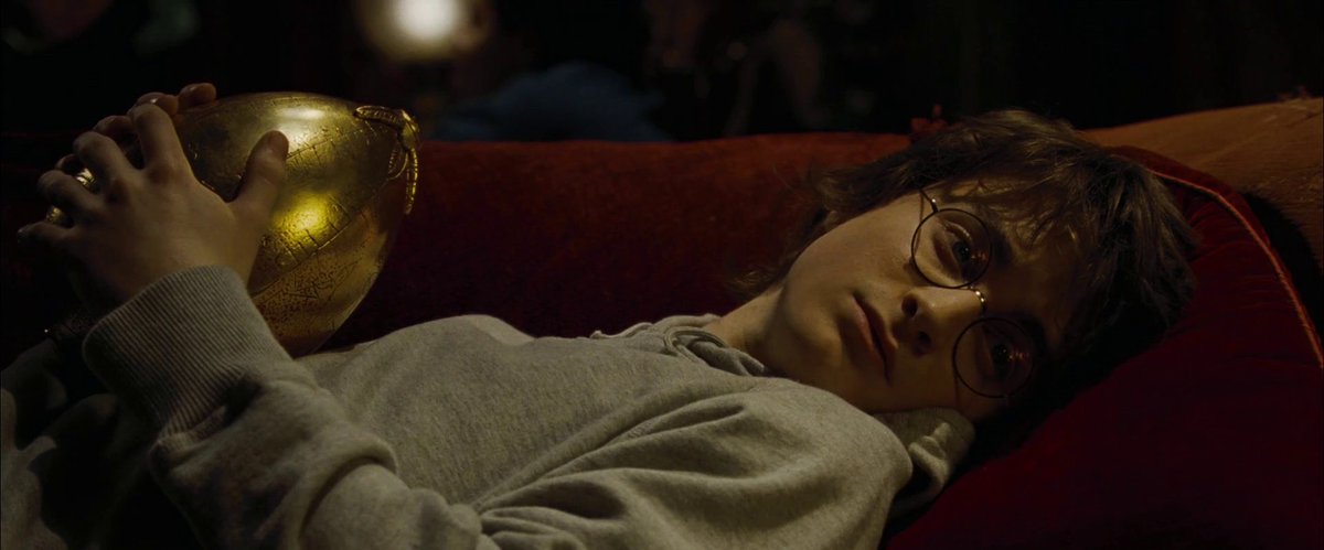 theboywhxlived's tweet photo. sometimes you just have to lie down and hold an egg and be emo https://t.co/Ixhq7piLXN