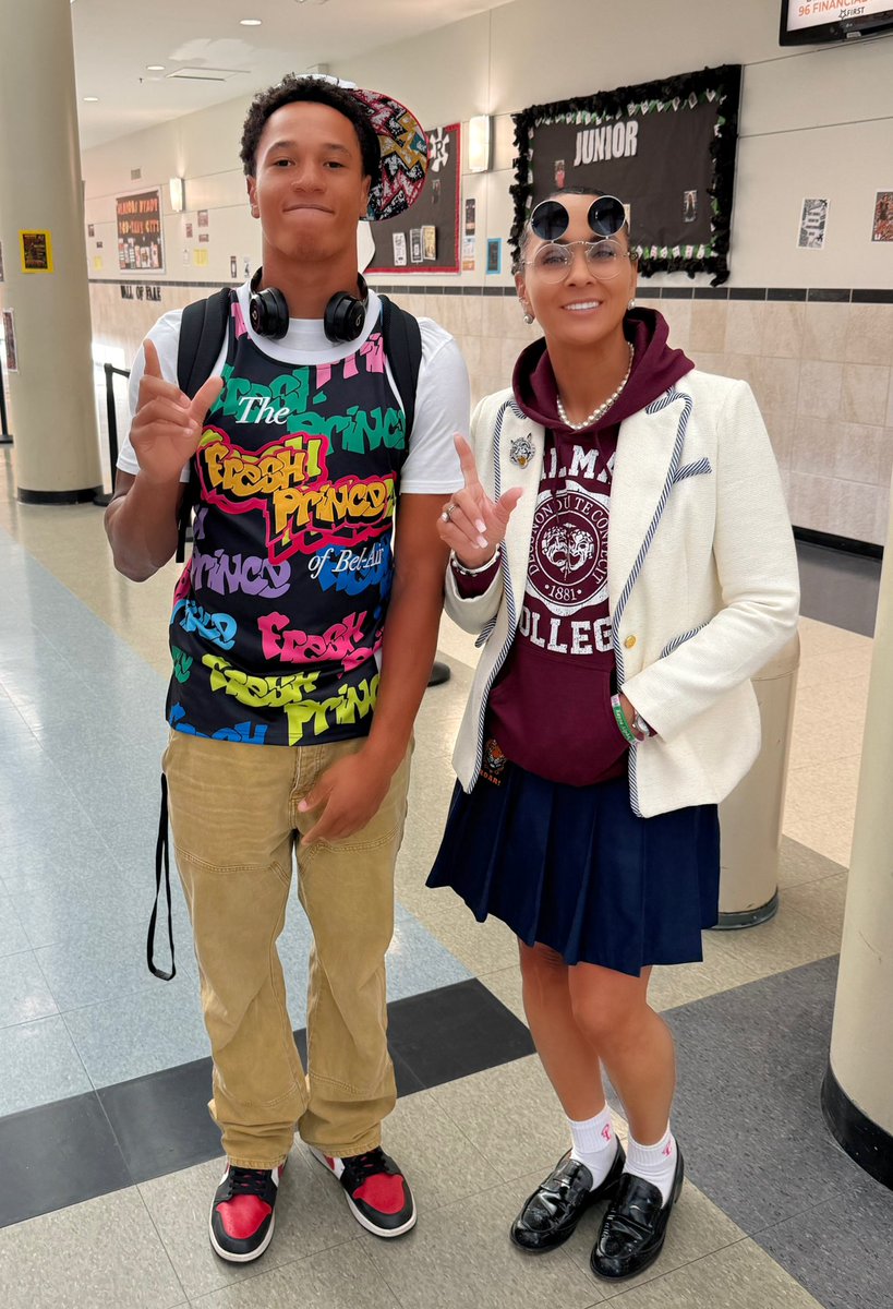 akperera's tweet photo. It’s HoCo2026 at @WEBO_Tigers - Today’s theme was “Sitcom Royalty” 🙌🏽  Our own @2wayFoster brought a fresh take on sitcom style to the school halls—looking like the Fresh Prince of campus! 👑📚 I channeled my best character collab from A Different World. 😜 https://t.co/8f3nzvwpUn