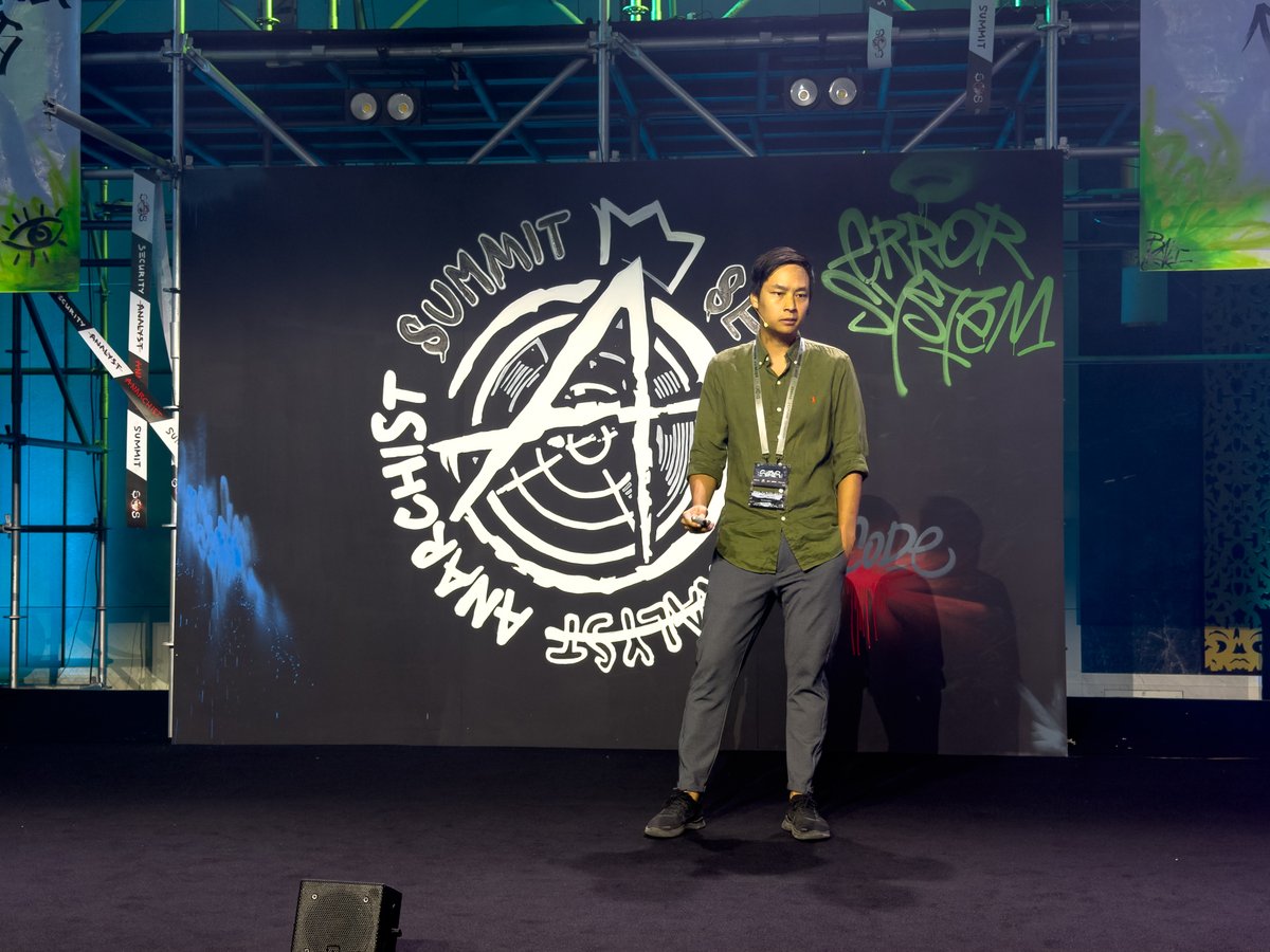 TheSAScon's tweet photo. Andy Nguyen (@theflow0) takes the stage at #TheSAS2026 to walk us through #PS5 security architecture, all the sensible security measures Sony took to prevent piracy and cheats, and what it took to build an exploit chain to break into the hypervisor and eventually run Linux instead of vanilla 7.61 firmware.