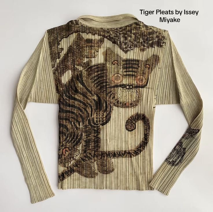 rogue's tweet photo. This iconic Issey Miyake Tiger Cat shirt is a masterpiece of wearable archival fashion history https://t.co/SuHU9yVzsO