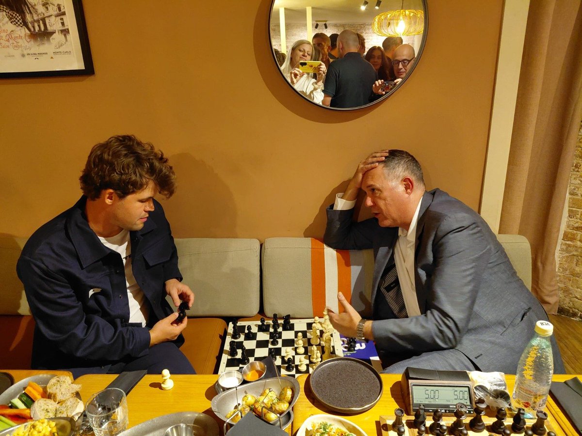 illescasmiguel's tweet photo. Great time yesterday with @MagnusCarlsen  at Bar 64 #Barcelona after the Move Cup press conference. He was super friendly as we discussed the heavy focus on modern theory... and even played some #dragonchess! Look closely at f1: yes, that's the dragon right there! ���♟️ https://t.co/y5Ya5Hiahm