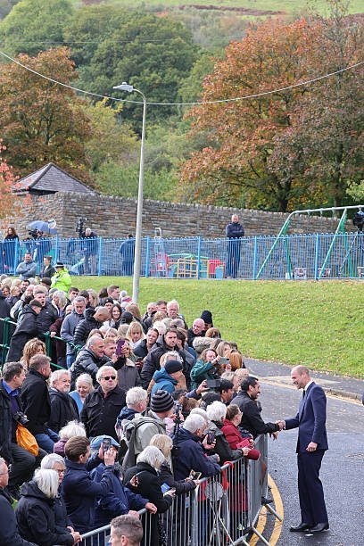 True888Blue's tweet photo. People lined the streets outside Aberfan Memorial Garden to meet Prince William, the Prince of Wales, who was there to commorate the 60th anniversary of the Aberfan disaster in Merthyr Tydfil, Wales on 21 October 1966 when doed 144 people, including 116 children. https://t.co/fqpp2a5Piy