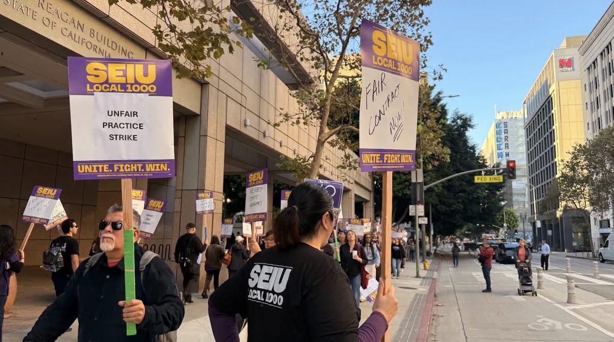 SEIU's tweet photo. Today, @SEIU1000 members are taking a historic stand and striking across California! They are the nurses, custodians, IT specialists, educators, analysts and scientists who keep California moving forward across 140 state departments. Now they’re protesting bad faith bargaining by the state and they are fighting for a contract that lets them afford to live in the communities they serve!