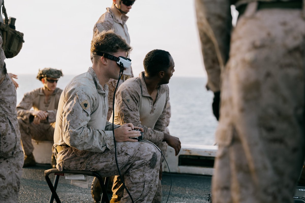 CENTCOM's tweet photo. U.S. Marines train with small unmanned aerial systems on the flight deck of USS Portland (LPD 27) as the ship sails in the Arabian Sea. As an innovation battle lab, CENTCOM fields a variety of emerging technologies to rapidly equip deployed service members with cutting edge capabilities.