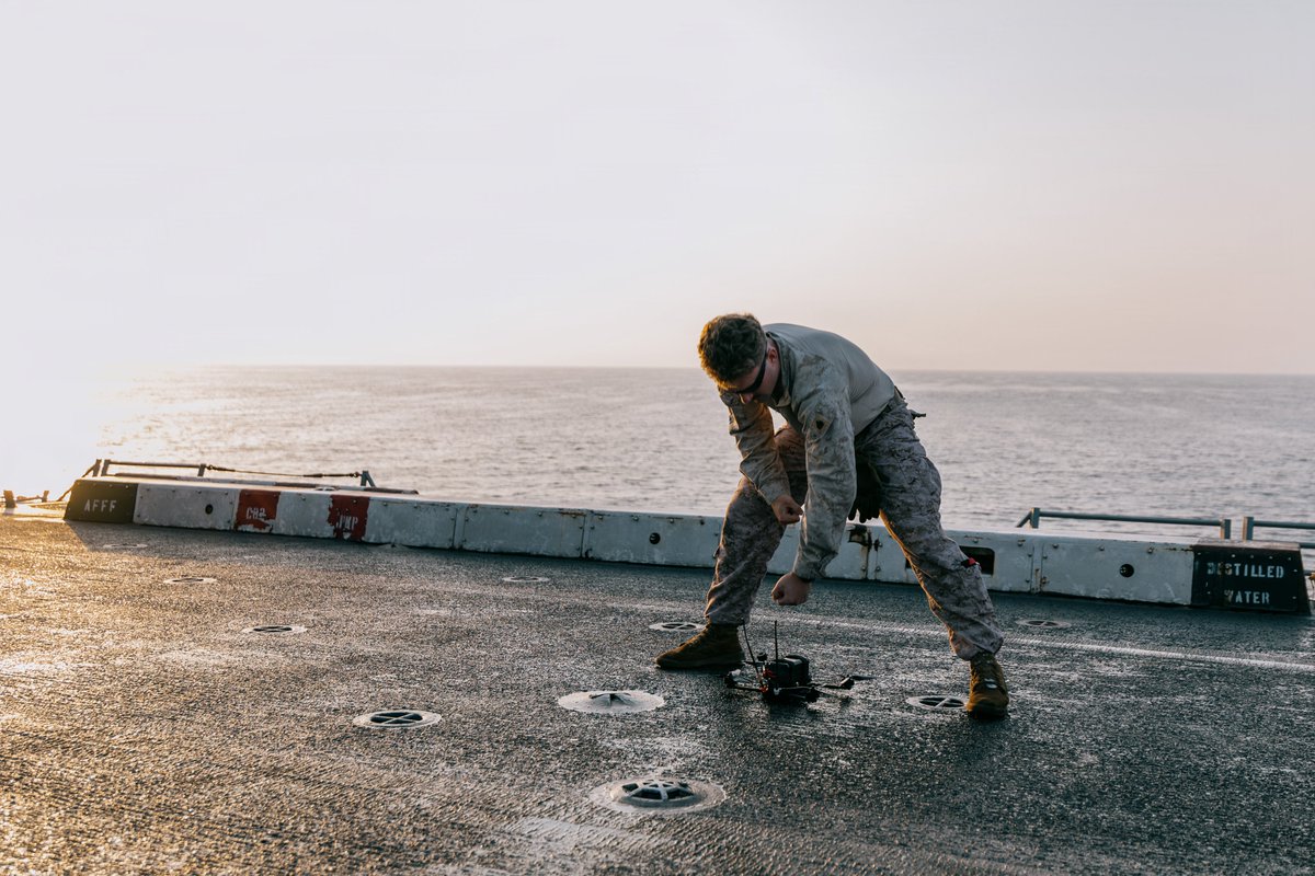 CENTCOM's tweet photo. U.S. Marines train with small unmanned aerial systems on the flight deck of USS Portland (LPD 27) as the ship sails in the Arabian Sea. As an innovation battle lab, CENTCOM fields a variety of emerging technologies to rapidly equip deployed service members with cutting edge capabilities.