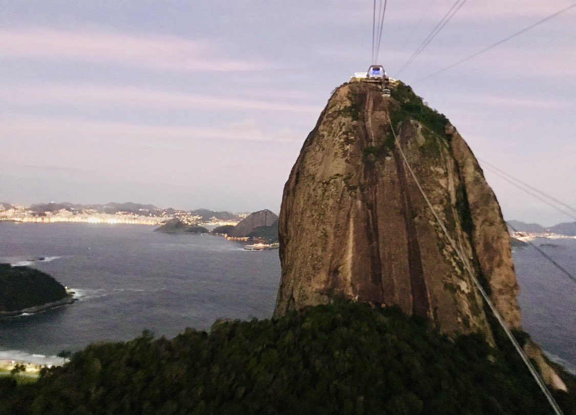 World's tweet photo. Soaring above the coastline as twilight falls. Views from the cable car ride are unmatched. 🚠✨

Quick Travel Trivia: Do you know the famous mountain peak and city hosting this breathtaking cable car system? 👇

￼ 📍 Brazil 🇧🇷
#Travel #Brazil #Wanderlust #ExploreTheWorld #SouthAmerica
