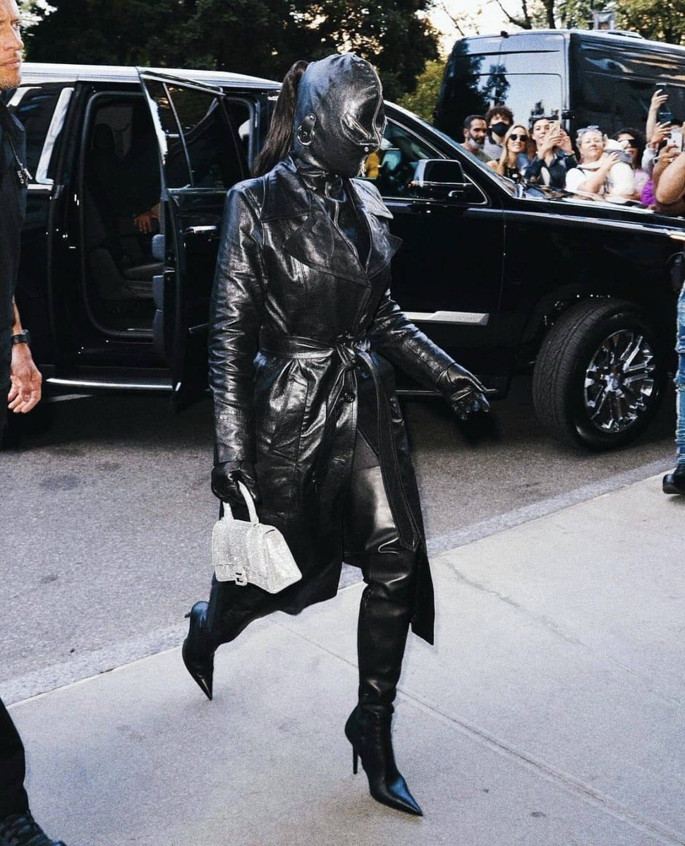 DodoFits's tweet photo. Kim Kardashian wearing Vetements SS19 Gimp Mask Trench Coat by Demna (2021) https://t.co/iZ7mmRN8K1