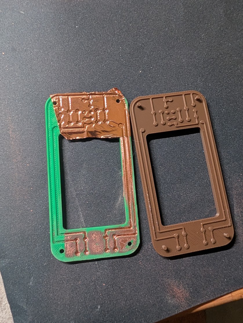 Opifex__'s tweet photo. DIY PCB experiment: 3D-printed base + copper tape.

Some intial thoughts
• P400 barely removed the excess copper, it was quite annoying. Trying P240 next.
• The cheapest copper tape I could find seems to work just fine. 
• Overlapping strips also seem to conduct fine. https://t.co/yuljcXT3gE