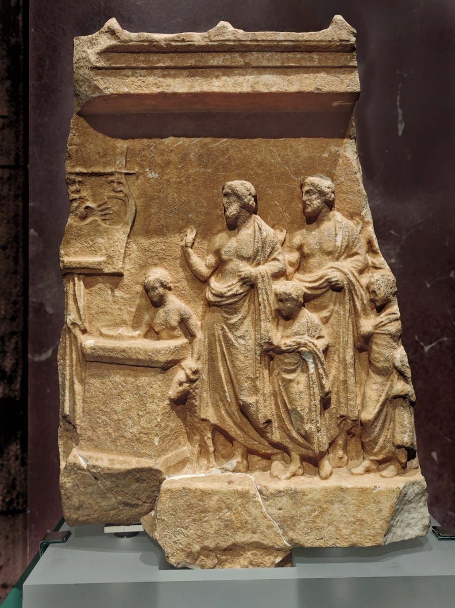 antmoose's tweet photo. For #ReliefWednesday, this C4 BCE #Greek #relief in the Ny Carlsberg Glyptotek is dedicated to #Apollo Patroos. Civic brotherhoods commissioned these as youths entered the citizen body. The painted pinax on the wall is a brilliant meta-reference to the dedication itself. https://t.co/Xotz47kUrF
