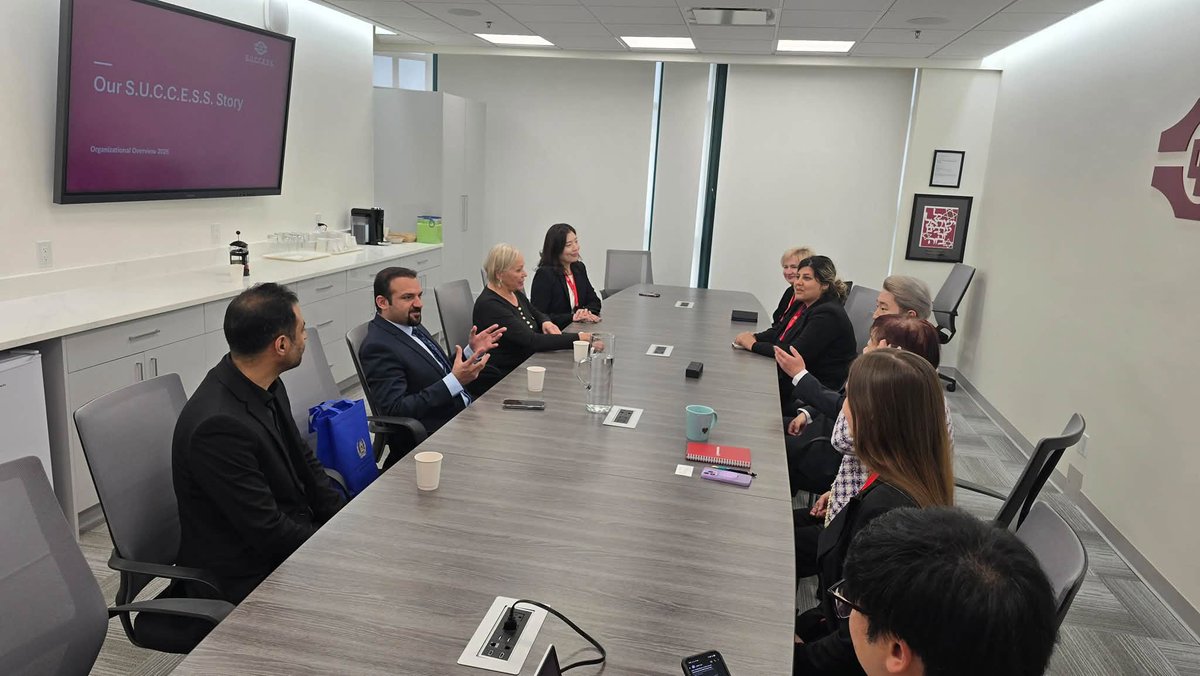 RaminManawi's tweet photo. I had the pleasure of meeting with Ms. Queenie Choo, CEO of S.U.C.C.E.S.S., Mr. Yoon Lee, Program Manager of Counselling and Crisis Support, and members of their team to discuss services for refugees and newcomers and opportunities for collaboration on October 13, 2026.

The S.U.C.C.E.S.S. leadership provided an informative overview of the organization’s history, local and international presence, and wide range of services. Serving more than 70,000 clients in the past year, the organization supports newcomers through programs related to housing, employment, language services, counselling, crisis support, and mentorship. We also learned about its involvement in initiatives such as the Resilience BC Anti-Racism Network and the BC Safe Haven Program.

I expressed my appreciation for the important work S.U.C.C.E.S.S. continues to do in serving diverse communities. We discussed some of the challenges faced by newcomers from Afghanistan, particularly in the areas of housing, employment, healthcare, and access to essential services, and exchanged views on ways to strengthen support for Afghan refugees and immigrants.

I also encouraged members of the Afghan-Canadian community to learn more about and benefit from the services and programs offered by S.U.C.C.E.S.S. We discussed opportunities for the Consulate to help connect community members with these resources, mobilize volunteers, and explore other ways of supporting the organization’s work.

The visit also included a tour of the three-storey facility, including its administrative and counselling offices, outdoor community spaces, and gymnasium used for recreational activities for youth and seniors.

I look forward to exploring opportunities for future collaboration with S.U.C.C.E.S.S. to support newcomers from Afghanistan and contribute to their successful settlement and integration into Canadian society.

My sincere appreciation to Ms. Choo, Mr. Lee, and their team for their warm welcome, informative discussions, and continued service to newcomers and the wider community.
