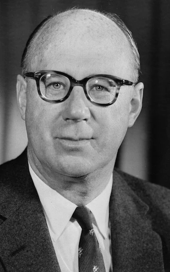Handre's tweet photo. John Cowperthwaite did more for human prosperity than any development economist drawing a government salary ever managed, and he did it by refusing to do almost anything at all.

As Hong Kong's Financial Secretary from 1961 to 1971, Cowperthwaite ran one of the most radically free economies the modern world has ever seen. He kept taxes flat and low (the top income tax rate sat at 15%), ran consistent budget surpluses, abolished import tariffs, and blocked nearly every subsidy request that crossed his desk. When British civil servants demanded economic statistics to justify intervention, he refused to collect them. Not out of laziness. He genuinely believed that giving planners numbers gave them excuses.

The results? In 1960, Hong Kong's per capita income stood at roughly 28% of Britain's. By 1997, Hong Kong had surpassed Britain. That trajectory happened without natural resources, without foreign aid, and without a single five-year plan drafted by well-intentioned economists from Oxford. Hong Kong had a harbor, people willing to work, and a bureaucrat with enough intellectual discipline to keep the state out of their way.

Capital flows toward secure property rights and reliable rules, and flees the moment politicians start allocating it. Every industry Beijing picked as a "priority sector" during those same decades burned through subsidies and produced junk. Hong Kong's industries emerged organically, serving real demand, building real wealth.

You benefit from this history whether you know it or not, because Hong Kong's success gave the world a controlled experiment that still embarrasses every advocate of managed development. The control group thrived. The planned economies didn't.

Cowperthwaite retired to St Andrews, received a knighthood, and gave almost no interviews. That restraint was entirely in character.