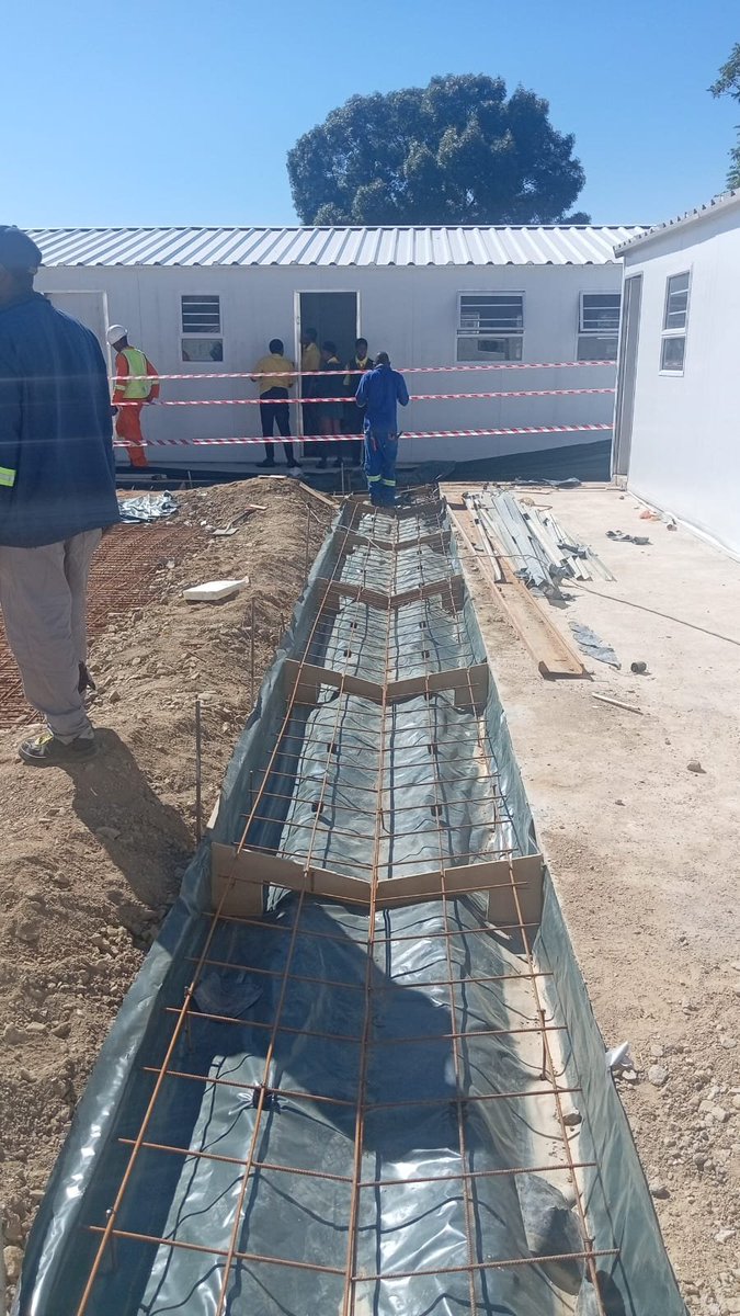 GPDID's tweet photo. 🏫 Site Inspection at St Ansgar’s Combined School in Randburg

The A-Team visited St Ansgar’s Combined School in Randburg to monitor construction progress, assess workmanship and identify issues that need attention. The project aims to improve school facilities for learners and educators. 

🚧 The second phase of mobile classrooms has been assembled, with paving, verandas and water channels still underway. However, electrical and mechanical works, plumbing, sewer and stormwater issues, and workmanship defects require urgent attention. Safety concerns around open trenches must also be addressed.

🛠️ The contractor must submit a realistic recovery plan with clear targets for completing outstanding work and urgently address the identified safety and technical concerns. 

The Department will continue monitoring progress, quality and safety to ensure the project meets the required standards.

#GrowingGautengTogether #ProudlyDID