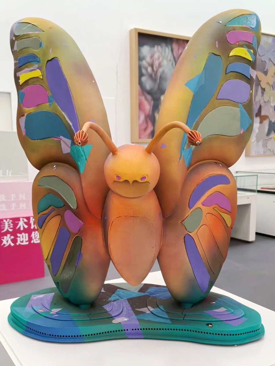 liangfe70628787's tweet photo. This is a contemporary butterfly sculpture. With soft cartoon styling and rich patchwork colors, it is a trendy art exhibit displayed in the art museum. It adopts a dreamy and childlike style, transforming the butterfly into a lovely anthropomorphic image. https://t.co/E85Va9GZOU