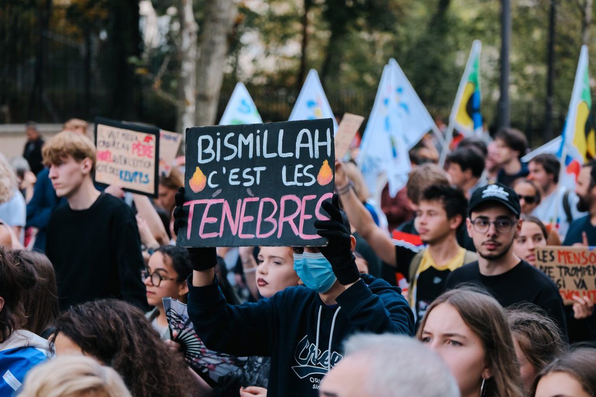FreeBeacon's tweet photo. Rioters in France have displayed signs bearing the slogan, “bismillah c’est les ténèbres,” which the New York Times describes as “a mash-up of the Islamic blessing ‘In the name of God.’” 

That would suggest that the riots have something to do with unfettered immigration. Just don’t tell that to the New York Times, which has pinned the protests on vague forces in coverage that is “so biased it’s actually funny,” @IraStoll writes.