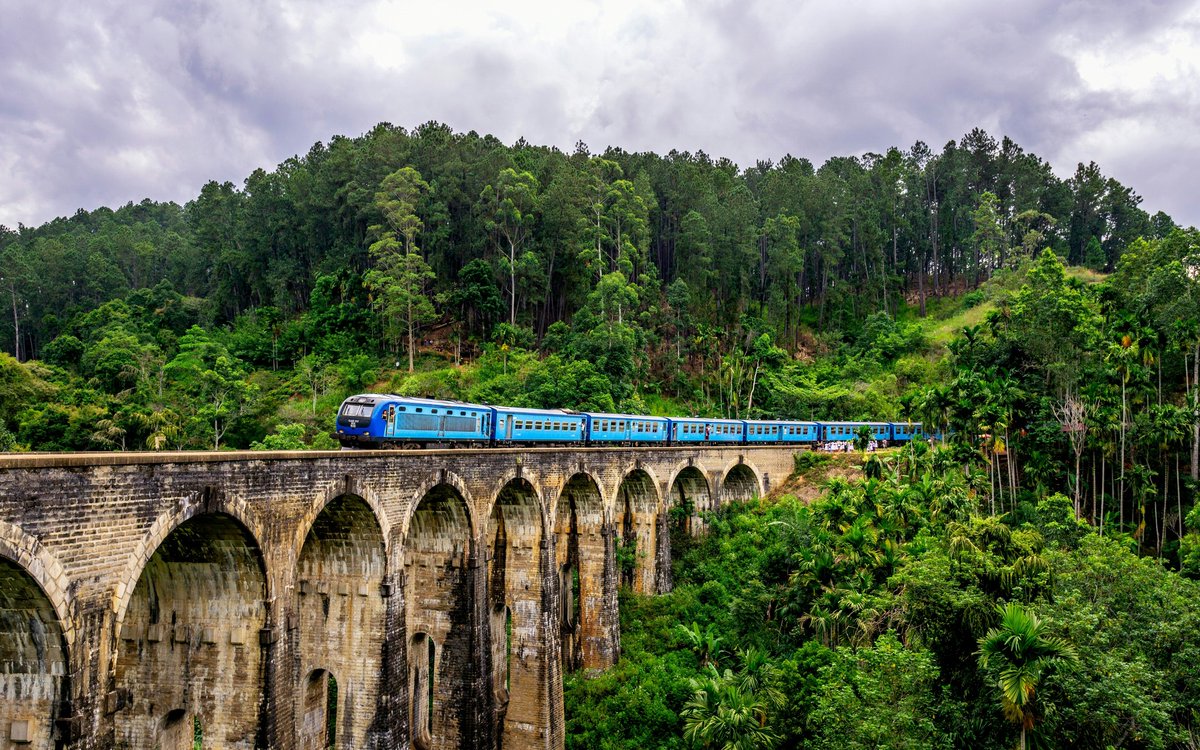 matuconov's tweet photo. Nine Arches Bridge in Ella, Sri Lanka, is where history, tea-covered hills, and tropical forest meet. Watch the train cross its elegant arches, then wander the peaceful landscape. Here, the journey is the destination. https://t.co/bqyMCXFjoB