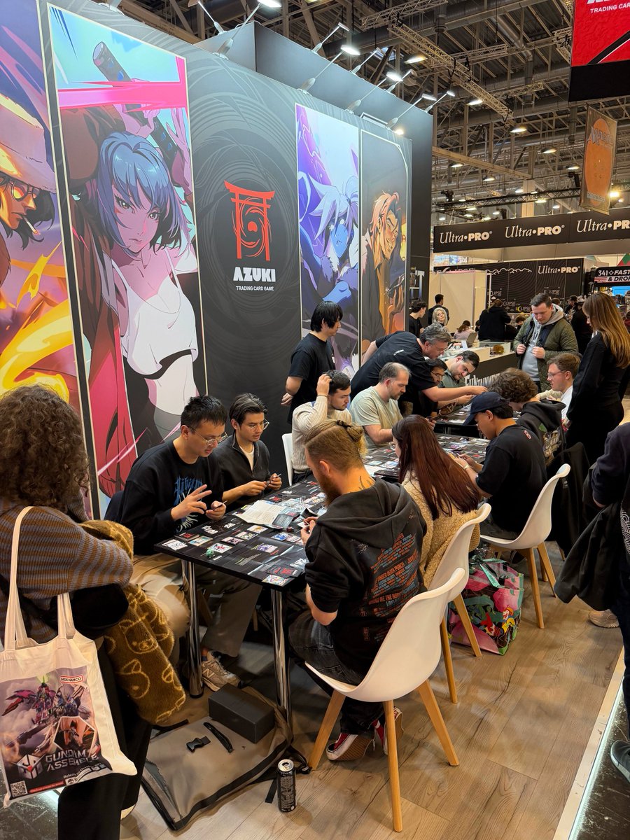 AzukiTCG's tweet photo. Day 1 at SPIEL Essen: our demo tables were full all day, with players and store owners learning Azuki TCG.

We're here through Sunday. Stop by Hall 5, Booth C400 to learn to play, meet the team and pick up an exclusive promo card! https://t.co/7Ii3wBIWC3