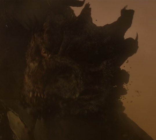 thatvenomfanboy's tweet photo. I was watching Ghidorah’s death in KOTM when only Ichi remains and his reactions. When he emerges from the rubble it’s almost like he wasn’t being bitten by Godzilla,and the second image it’s like he feels Godzilla biting into him and realizing Godzilla survived the explosion too https://t.co/N6L8raXWsN