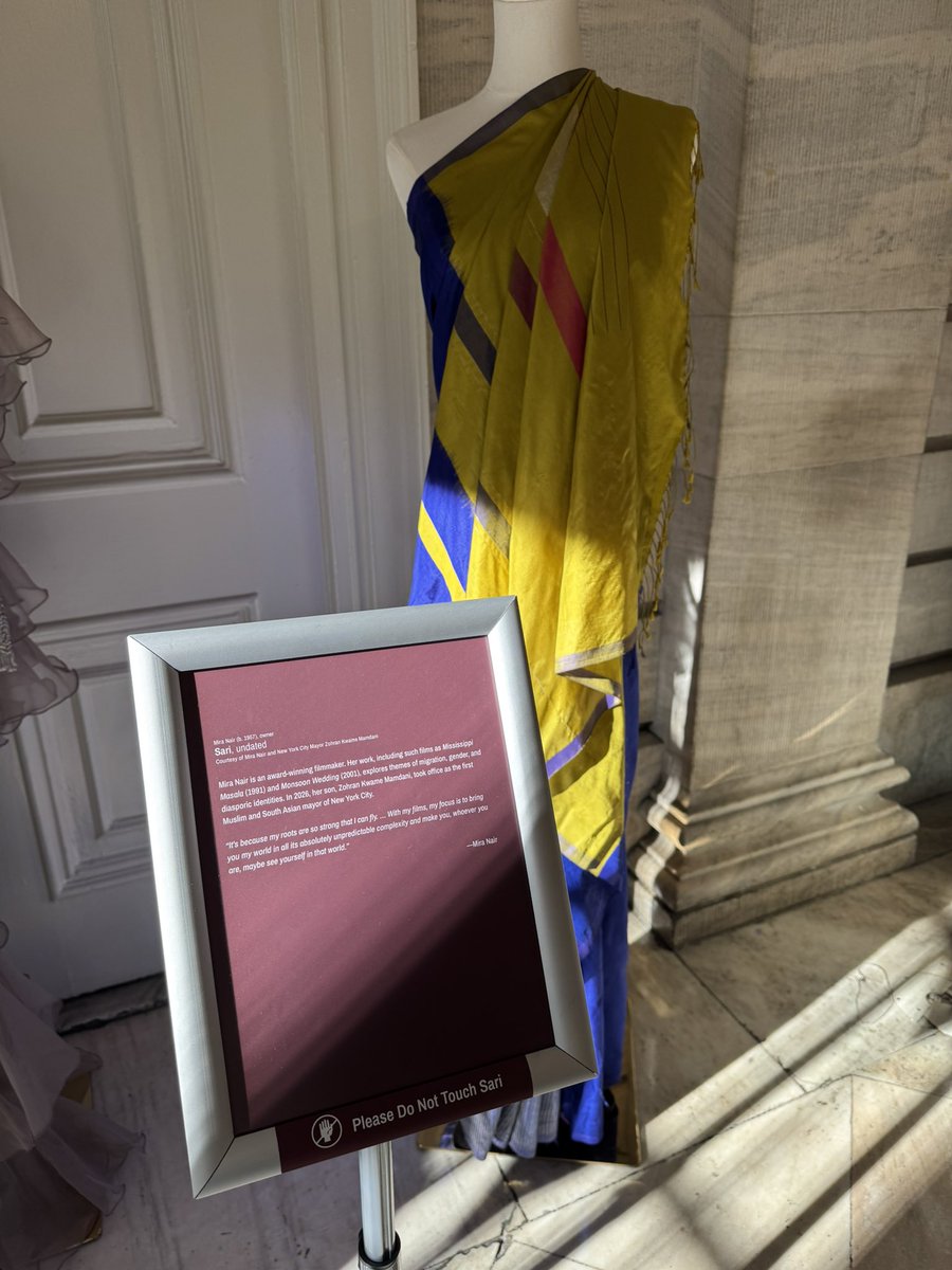 katie_honan's tweet photo. There’s a sari exhibit at City Hall featuring those worn by Mira Nair, a filmmaker and @nycmayor’s mom, and one worn by @CMShahanaHanif when she was sworn into the council https://t.co/ESSF1tHvoo