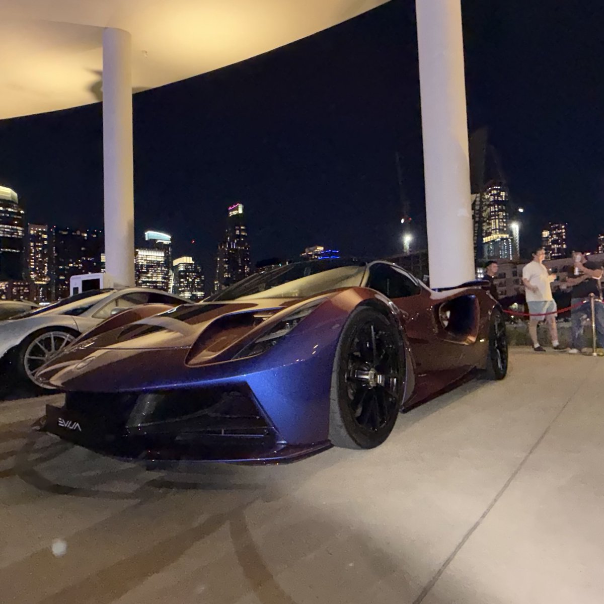 Serenity_Now247's tweet photo. Lotus Evija, Lotus’s first pure EV, 2,000 horsepower across four motors, zero to sixty in under 2 seconds, and only 130 ever being built at around $2.1 million each. I was lucky to spot one the other night at the Long Center with friends @artsimage & @AdanGuajardo it’s a gorgeous car! I love how the license plate light project on the ground behind the car ⚡️✨🛸