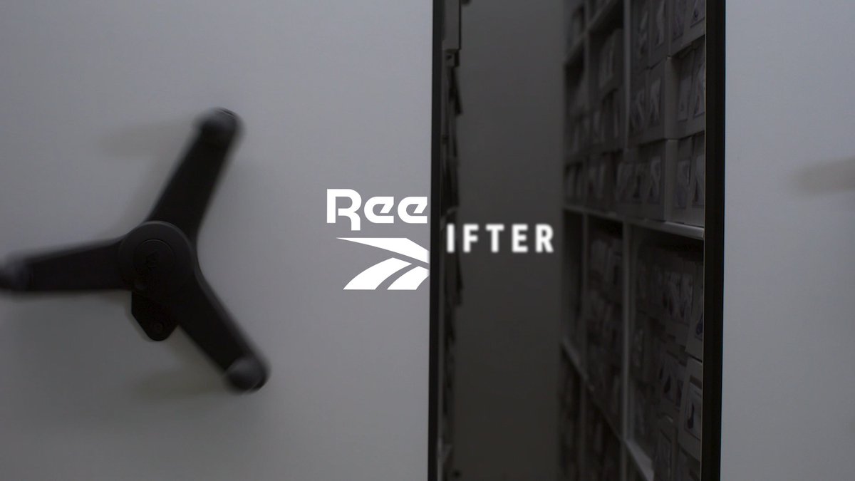 A dim interior shot with a large “Ree…”/“IFTER” logo partially obscured by a dark shelf or doorway.
