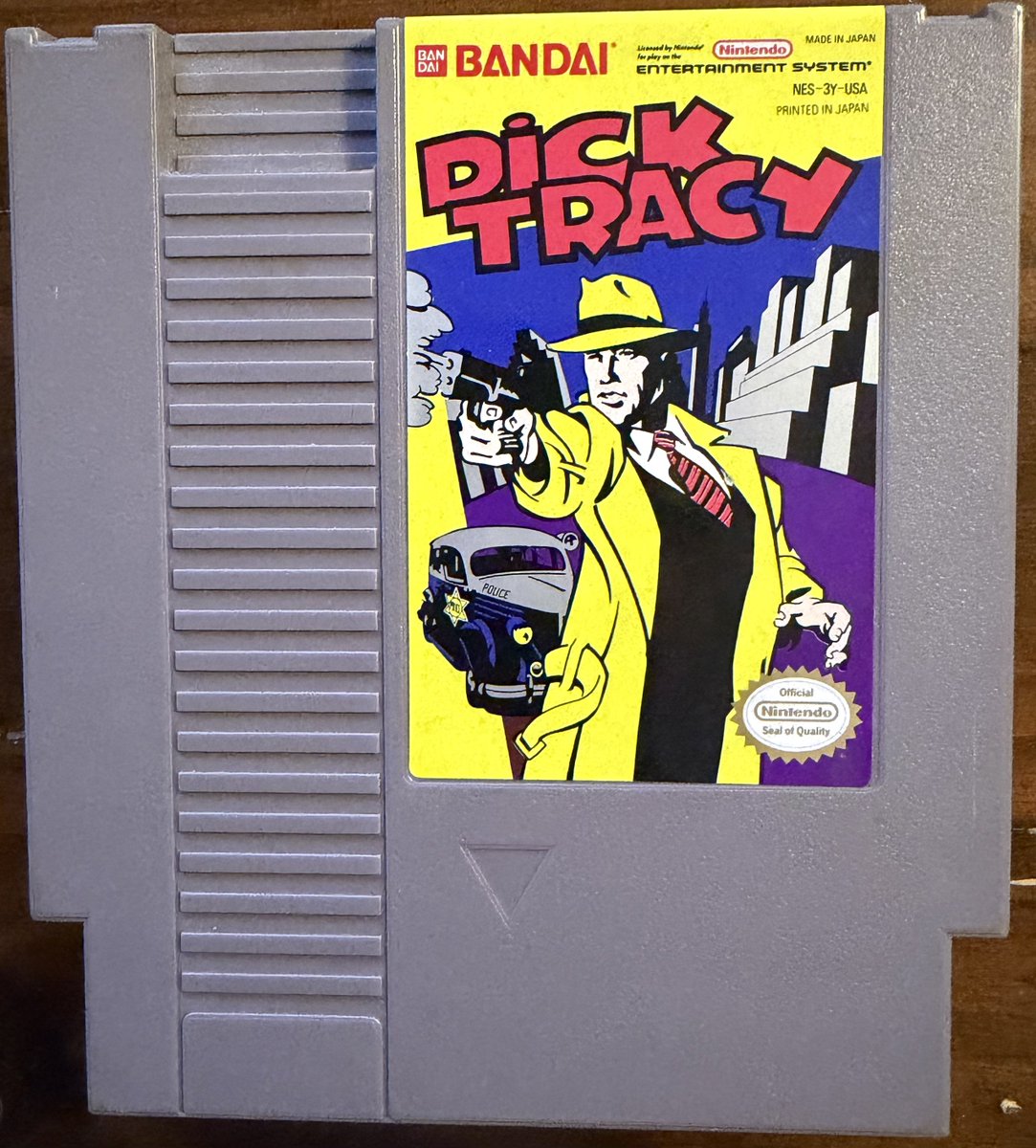 doomguy255's tweet photo. Yes it’s Dick Tracy which I’m sure we all remember fondly and from the AVGN episode.

Despite being part of the marketing blitz for the movie starring Warren Beatty, Al Pacino and Madonna. This game is not based on the movie. Instead you solve cases leading up to a bank robbery and the arrest of Big Boy Caprice.

Dick Tracy NES
Publisher: Bandai
Developer: Realtime Associates
Released: August 1990