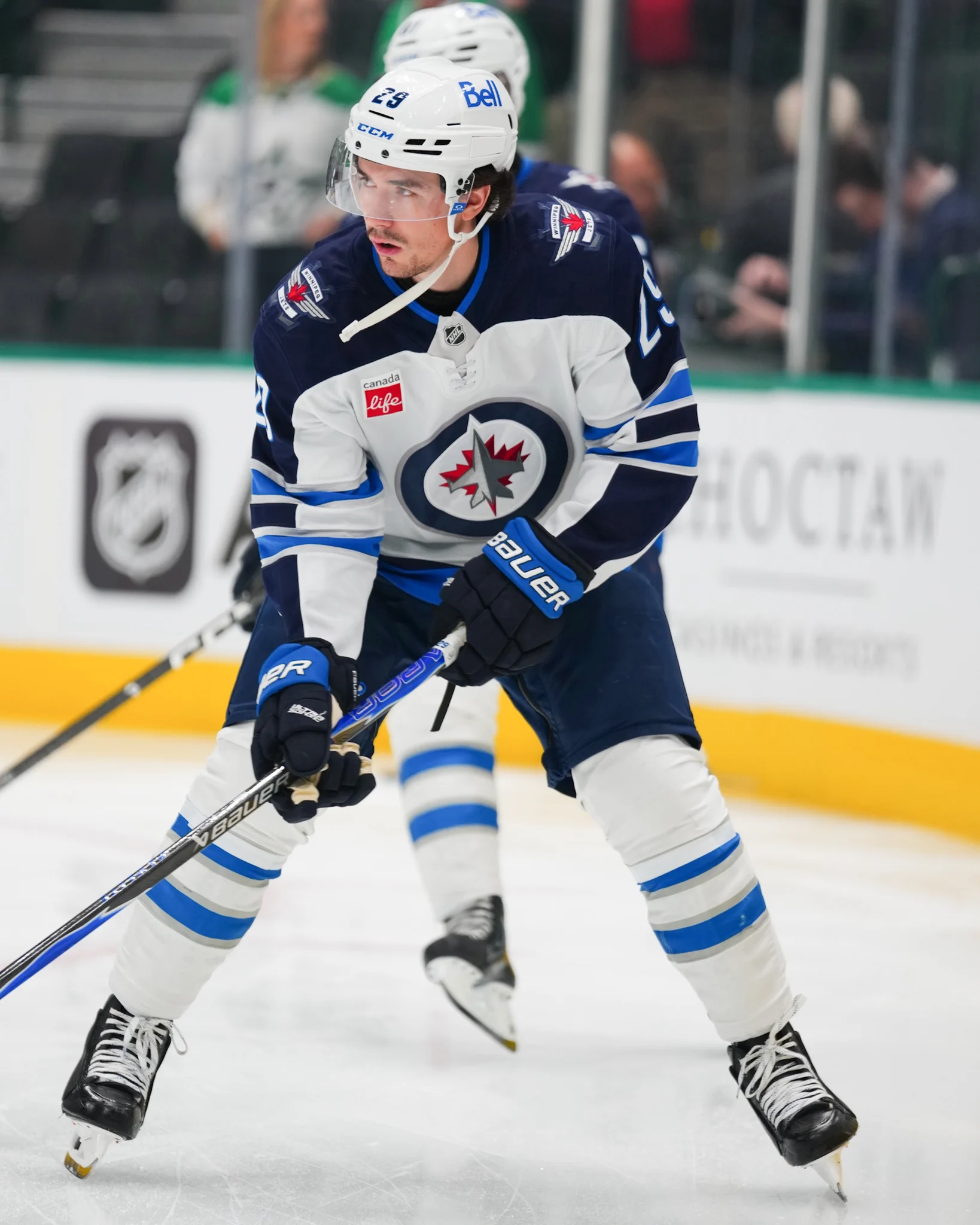 Brayden Yager warming up on ice in a Jets uniform.