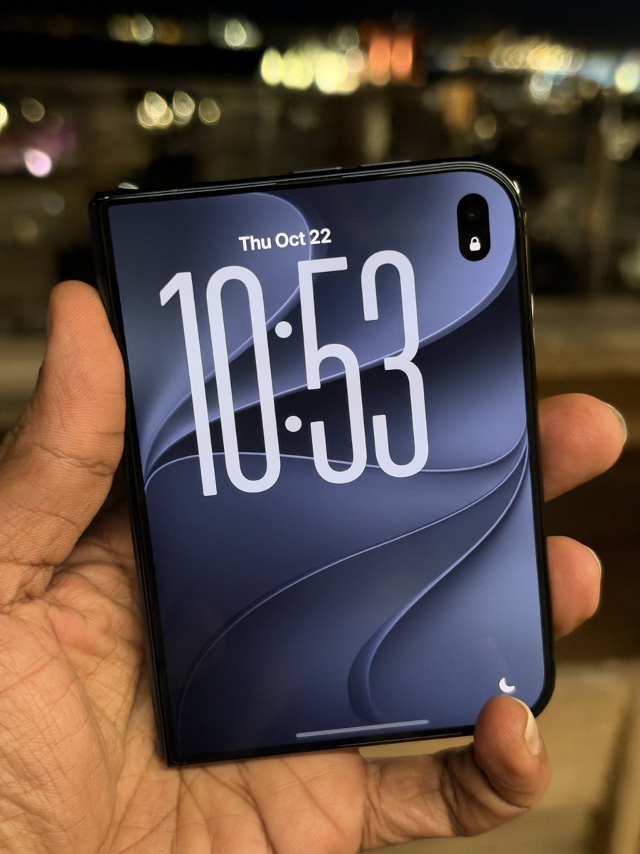 nirave's tweet photo. Happy iPhone Duo day! Mine is not arriving today (thanks to the incompetent folks at @ee) but I saw it yday and damn, I really like this form factor and hardware!

Also the Nano texture display is really nice, a different take on the crease but a good one! More thoughts soon! https://t.co/vkZzZ463BA