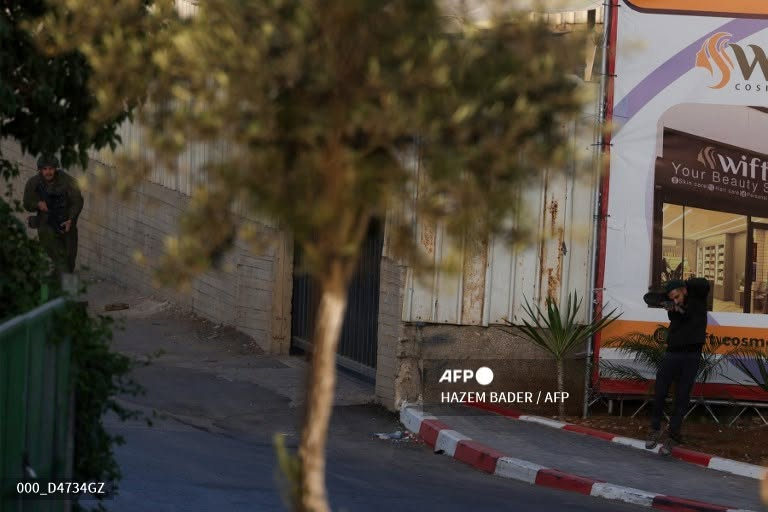 EBluemountain1's tweet photo. 🚨 Israeli security services are currently interrogating @hazemjbader a photographer who works for @afpfr suspected of having prior knowledge of the terror attack in Hebron today. Not the brightest, the idiot immediately posted the images on his @facebook page with The AFP stamp
It is alleged that he positioned himself for the best cover possible. Not Journalists simply Hamas operative with a camera funded by Western Media