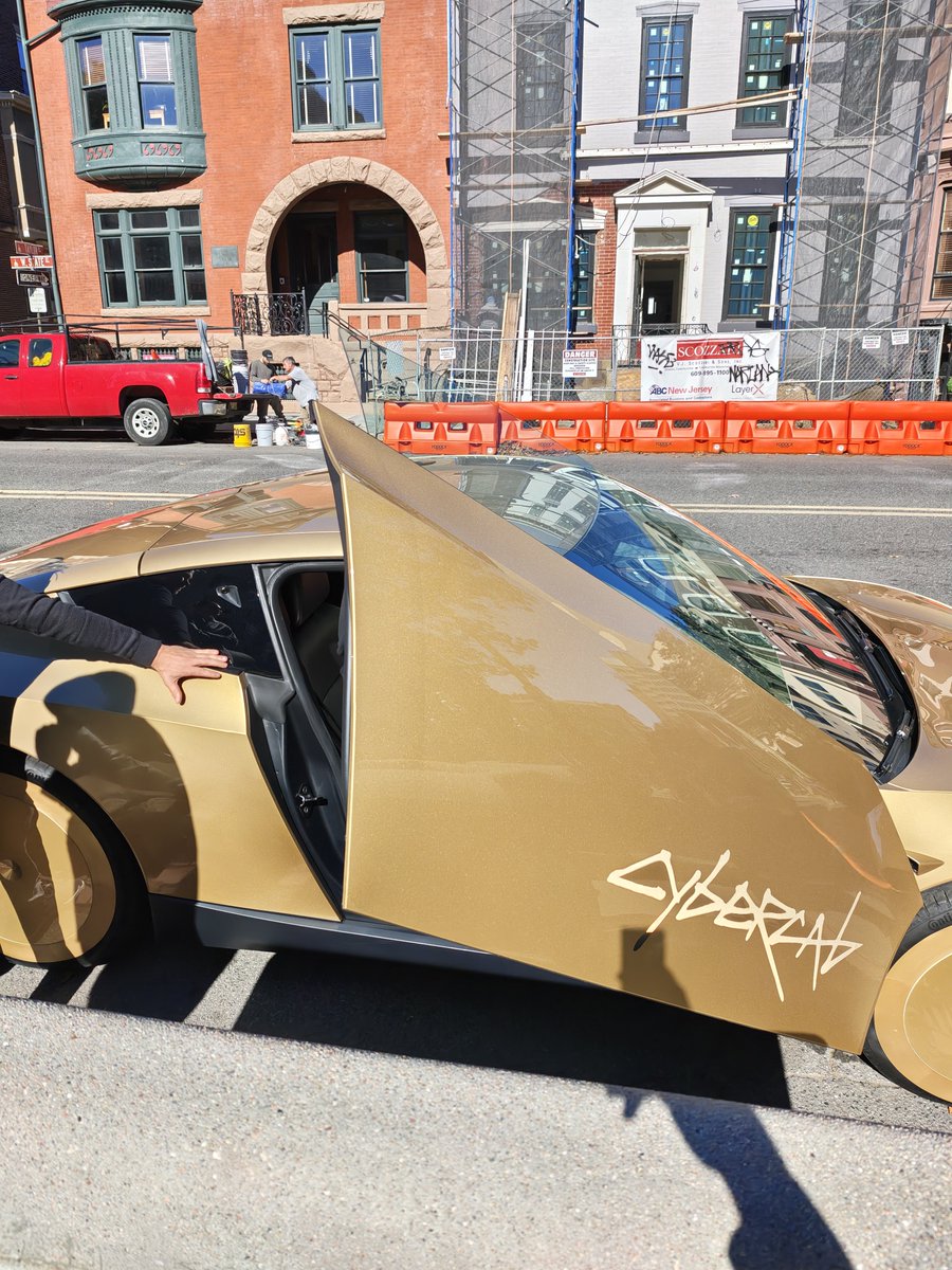 danielrstrack's tweet photo. I saw a @Tesla @robotaxi outside of the NJ State Annex House yesterday. They were giving rides to reps. Confirmed there is testing going on in NJ with robotaxis that have steering wheels and pedals (likely what I saw on the Parkway last week). Let's GO #NewJersey!! https://t.co/Z36uMdqJJb