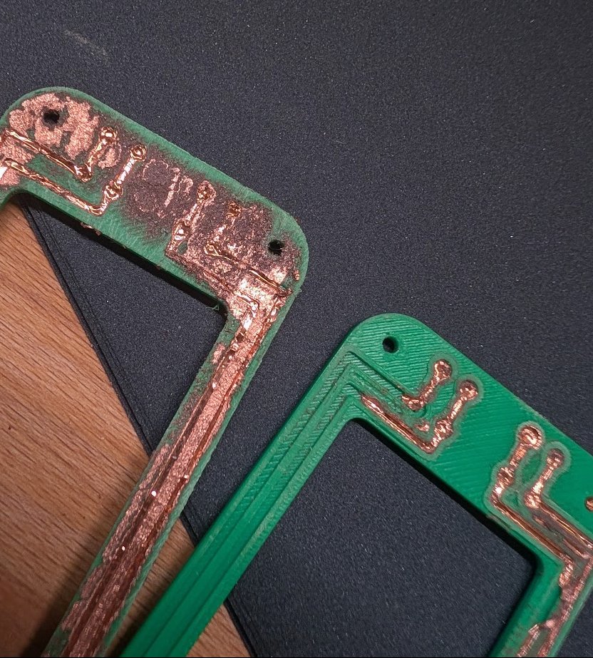 Opifex__'s tweet photo. DIY PCB progress:
Flat PCB surface vs  raised edge around the PCB traces, both after sanding 

Raised edges were WAY faster to sand too!

Still tweaking some parameters, as the sandpaper sometimes catches and rips the copper out from the channels https://t.co/DUzbBodvmA