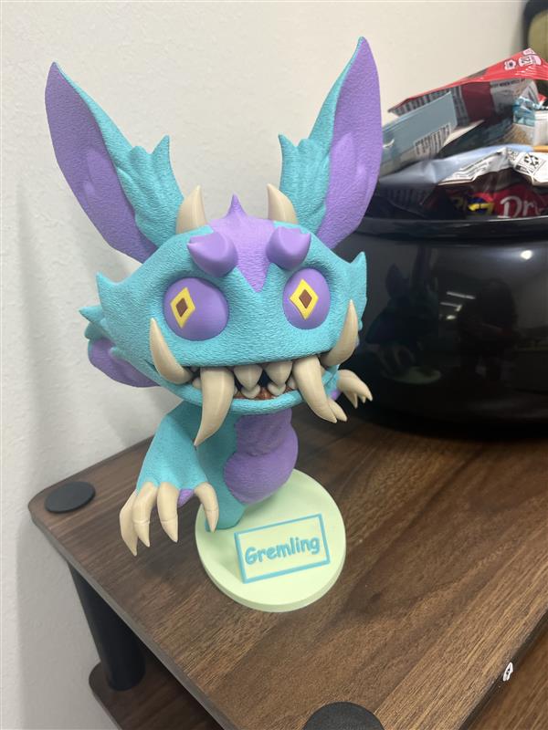 Wizard101's tweet photo. Would you dare steal a snack from this guy? 😈

Our Senior HR Manager 3D printed the new Gremling pet, and he’s officially on cauldron duty! #Wizard101 https://t.co/IYelOKPoWZ