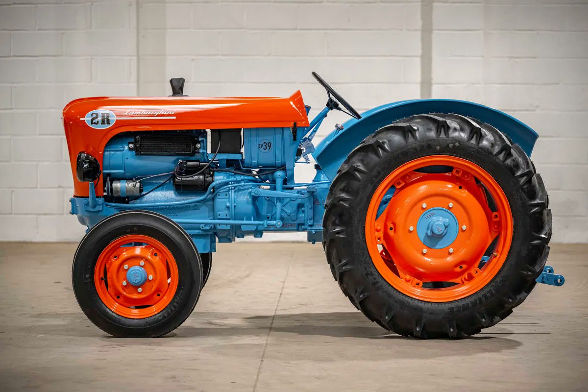 Auto_Revving's tweet photo. Before the supercars, there was the soil. This 1963 Lamborghini 2R tractor is the ultimate reminder of Ferruccio Lamborghini's roots before Enzo Ferrari made him mad. Absolute masterpiece in orange and blue. https://t.co/Uw4pPWQV0f