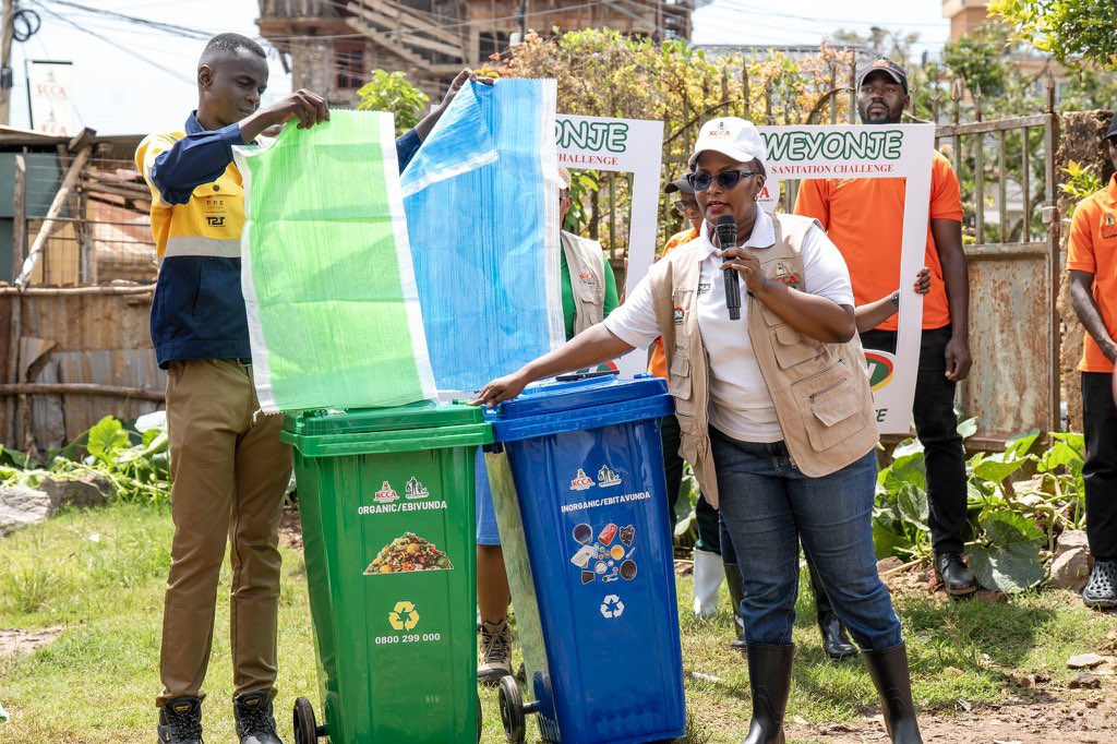 sarahkzalwango's tweet photo. THE ANNUAL WEYONJE SANITATION CHALLENGE AMONG KAMPALA’S FIVE DIVISIONS IS BACK! WHICH DIVISION WILL WIN THE TROPHY THIS YEAR? 🏆

Today, we launched the 2026 Weyonje Sanitation Challenge in Kitalanga Zone, Kasanga Parish, Makindye Division, together with Makindye Town Clerk Mr Ssentongo Thomas, Director Physical Planning @Byendaimira , Executive Secretary Public Health Hon @NalukwagoJudith , Makindye Division political leaders, LC1 Chairpersons, Makindye Community SACCO, @towauchafu , Tubikiima waste collectors and residents.

We kicked off the challenge with a community cleanup and sensitisation, engaging residents on proper waste management and collective responsibility for cleaner, healthier communities.

The five divisions will compete and be assessed on:
✅ Solid Waste Management ✅ Fecal Sludge Management ✅ Health Inspection ✅ Greening & Beautification ✅ Innovation

Which Division will rise to the top?
Makindye, are you ready to Weyonje? 

The battle for Kampala’s cleanest Division starts NOW! 🏆
@KCCAUG @Buzeki_Sharifah