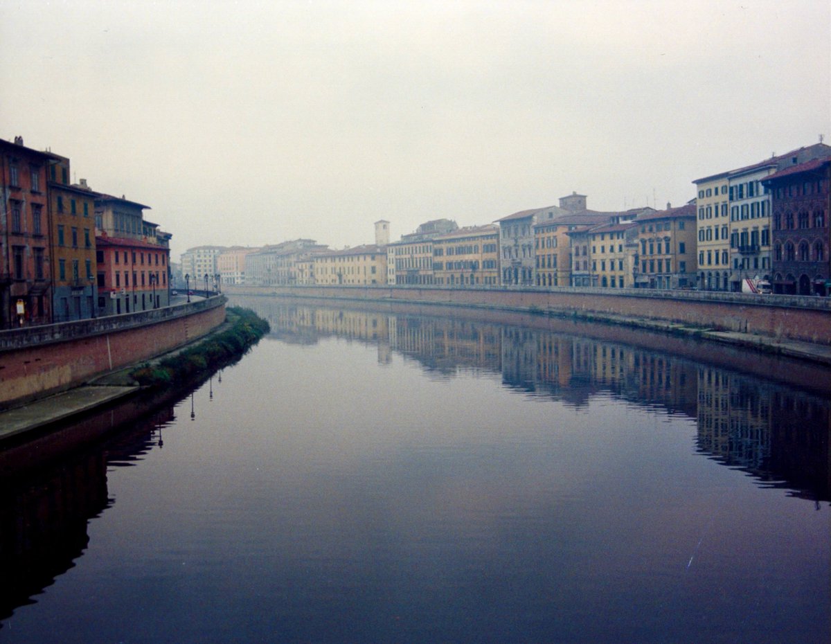 brunaganacin's tweet photo. Pisa, Italy. A misty morning on the Arno River, remembered from a backpacking trip long ago. Cheap hostels were full, so I spent my first night on a park bench. Waking early brought this perfectly calm reflection. https://t.co/w3w5aG87M4