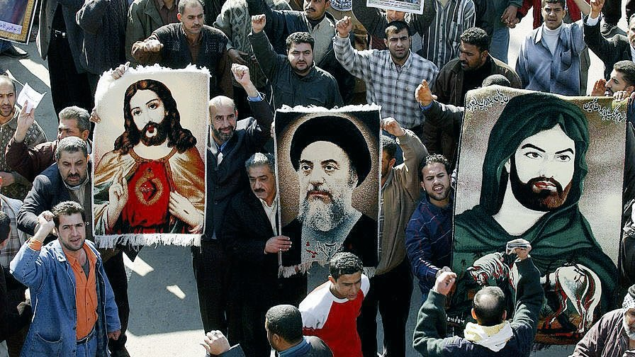 hashedelesood's tweet photo. During the Iraqi Shia-Sunni civil war, Christians whom lived amongst Sunni areas were targeted by Sunnis in consist suicide bombings at Churches &amp; Church processions.

Img of 2004, Shia of Iraq holding Christian &amp; Shia Images in solidarity. https://t.co/6cbgdS8dPD
