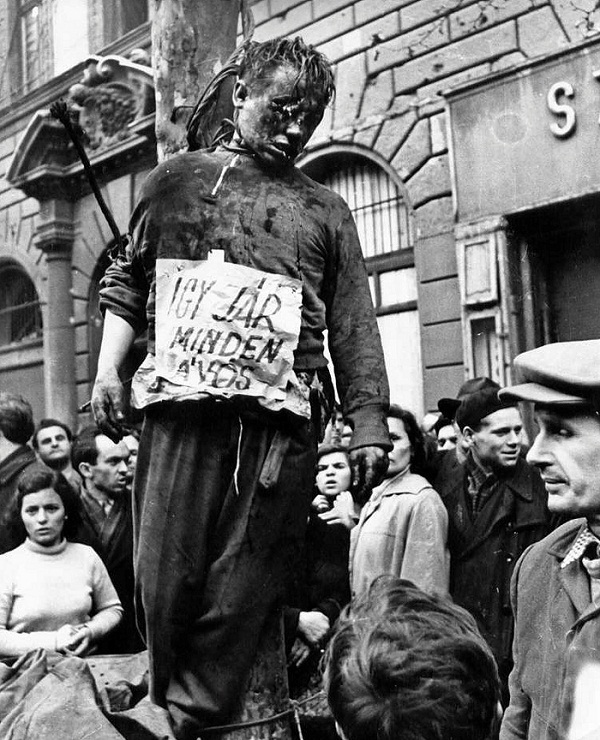 DaniMayakovski's tweet photo. El 23 de octubre de 1956, comenzaba un golpe de estado fascista contra la Hungría socialista, organizado por el imperialismo y liderado por antiguos criminales de guerra leales al régimen de Horthy, antiguo aliado de la Alemania nazi.

Los anticomunistas decapitaron, ahorcaron de los árboles, torturaron hasta la muerte y quemaron vivos a cientos de comunistas por las calles, con una brutalidad al estilo de ISIS en la actualidad, literalmente colgaban cadáveres por las calles y en los escaparates de las tiendas como trofeos... a esta barbarie en Occidente lo llamaron "revolución".

El golpe de estado se inició con una manifestación en Budapest, tras la muerte de Stalin, los imperialistas y sus aliados fascistas locales (células durmientes de la CIA) volvieron a sacar la cabeza tras más de una década escondidos, creyendo que podrían restaurar la barbarie capitalista en el pais aprovechan la muerte del líder soviético.

Obviamente todos estos criminales nazis estaban organizados por el imperialismo de antemano.... desde que acabó la Segunda Guerra Mundial, la CIA reclutó a todos los criminales de guerra nazis y organizó células durmientes en muchos de estos países del bloque socialista, en Hungría usaron a los antiguos colaboradores nazis como los miembros del partido fascista Cruz Flechada.... pero esto ocurrió en muchos otros países, por ejemplo los "Hermanos del Bosque" en Estonia, Letonia y Lituania, todo esto más tarde se llamaría Operación Gladio en Europa, pero se llevaba haciendo prácticamente desde que acabó la guerra en 1945.

Rápidamente los fascistas húngaros, entrenados y dirigidos por la CIA, organizaron bandas terroristas y se hicieron con depósitos de armas en Budapest.... todo bajo el mando del antiguo colaborador nazi, Pál Maléter, un traidor que primero renunció a ser nazi tras ser capturado por el Ejército Rojo en plena guerra mundial... y luego en 1956 renunció a ser comunista, lo cual nunca fue, solo era una alimaña sin espina dorsal que intentaba sobrevivir en la guerra y hubiese prometido ser budista si eso le hubiese salvado.

Los antiguos colaboradores nazis tuvieron el cinismo de autodenominarse "Luchadores por la Libertad", los comandantes de sus unidades estaban en su mayoría compuestos por antiguos oficiales del régimen colaboracionista de Horthy, gendarmes anticomunistas y miembros fascistas del partido antisemita de la Cruz Flechada, organizaron un ejército de hasta 20.000 soldados, obvio que no fue ninguna "revolución espontánea".

Durante el golpe de estado en Hungría, el imperialismo ni siquiera se escondía, abiertamente coordinaba la matanza desde los medios de propaganda de la CIA, como la Voz de América y Radio Europa Libre... estas emisoras no solo instigaron al golpe, prometían abiertamente el apoyo de los países de la OTAN antes de que la URSS interviniera.

Pero el imperialismo no solo tenía a las bandas armadas fascistas en la calle, también tenía controlados a enemigos internos... como el revisionista Imre Nagy, quién un día después del golpe de estado anticomunista, "casualmente" fue colocado en los altos cargos del partido y comenzó a liberar de prisión a criminales de guerra fascistas del antiguo régimen de Horthy, disolvió las unidades de seguridad e inteligencia y además se enfrentó a la URSS exigiendo la retirada inmediata de las tropas soviéticas... en pleno golpe de estado, más descarado imposible.

Bajo este panorama, en todo el país se extendió el terror fascista, las bandas armadas anticomunistas iban como la Gestapo cazando a todo sospechoso de ser comunista por la calle, todo ante los ojos de los corresponsales occidentales, que salivaban viendo como los comunistas eran colgados de los árboles y linchados hasta la muerte.... los cadáveres de los comunistas asesinados fueron exhibidos en los escaparates de tiendas saqueadas con carteles que rezaban "La moda de la temporada".
 
El golpe de estado anticomunista organizado por el imperialismo avanzaba paso a paso, el 2 de noviembre, el gobierno del títere de la CIA, Imre Nagy, anunció la salida de Hungría del Pacto de Varsovia y solicitó la intervención armada del imperialismo hasta en la ONU.

Cuando ya nada podría ir peor... surgió un grupo de comunistas disidentes al títere de Nagy, organizados por el lider János Kádár, quién anunció un gobierno alternativo al de Nagy para luchar contra el golpe de estado, llamándose "Gobierno Obrero-Campesino Revolucionario" y rechazando todas las medidas tomadas por el contrarrevolucionario Nagy.

El nuevo gobierno Kádár rechazó la salida del Pacto Varsovia y haciendo uso legal de ese pacto, solicitó ayuda al gobierno aliado de la URSS para aplastar el golpe de estado.... las unidades del Ejército Soviético, temporalmente estacionadas en territorio de la República Popular Húngara de acuerdo con el Pacto de Varsovia, prestaron ayuda el 4 de noviembre al gobierno provisional de Kádár y rápidamente aplastaron el golpe de estado, ejecutando más tarde a los líderes golpistas traidores y encarcelando a sus colaboradores.