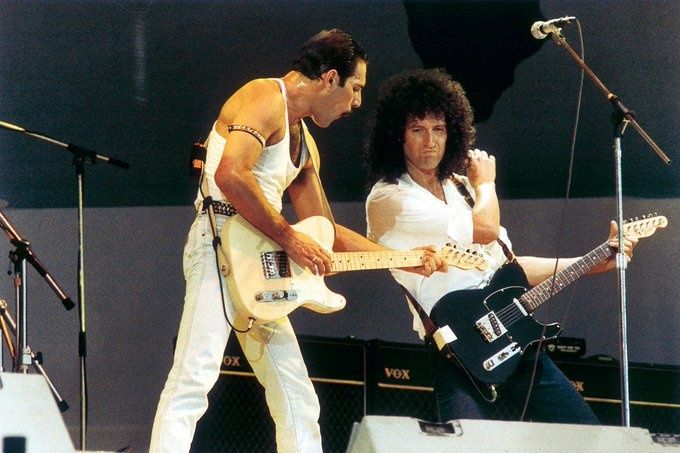 crockpics's tweet photo. Freddie Mercury and Brian May onstage with Queen at Live Aid, Wembley Stadium, London, on July 13, 1985, Freddie on a white Telecaster for "Crazy Little Thing Called Love."

Live Aid was organised by Bob Geldof and Midge Ure to raise money for the famine in Ethiopia, following the success of the charity single "Do They Know It's Christmas?" in December 1984. It ran simultaneously at Wembley and at JFK Stadium in Philadelphia, with around 72,000 people at Wembley and an estimated 1.9 billion watching the broadcast in 150 nations. Queen's 21 minute set began at 6:41 pm. They opened with an excerpt of "Bohemian Rhapsody," moved into "Radio Ga Ga" with the whole stadium clapping in time, then played "Hammer to Fall," "Crazy Little Thing Called Love," a short "We Will Rock You" and "We Are the Champions." Later in the evening Freddie and Brian came back out to perform "Is This the World We Created...?" from The Works. In 2005 the set was voted the best rock gig of all time, and it became the climax of the 2018 film Bohemian Rhapsody.

👑 Queen's set at Live Aid was voted the best rock gig of all time in 2005. Did you watch Live Aid live on TV that day? 👑