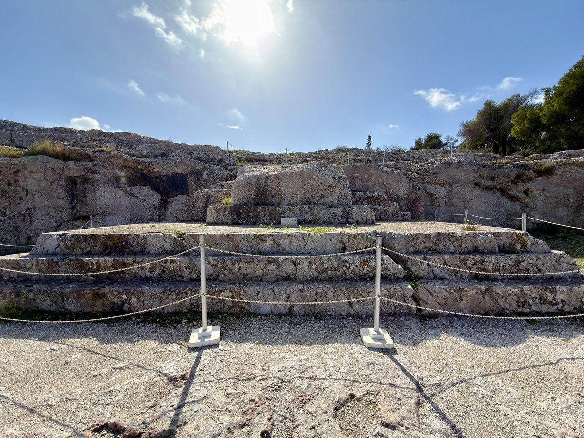 BrightInsight6's tweet photo. We were all taught that the Ancient Greeks created Democracy 2,500 years ago. But do you want to see something cool af that most people aren’t aware of?

This stone-cut platform located on Pnyx Hill in Athens, is the EXACT SPOT where Democracy was born in ~507BC.

Notice the Acropolis in the background. This is the place where several thousand people first assembled and essentially introduced freedom of speech, and voted on matters with the general public. This is where it happened, and the view they had when they did it. How freaking cool is that?