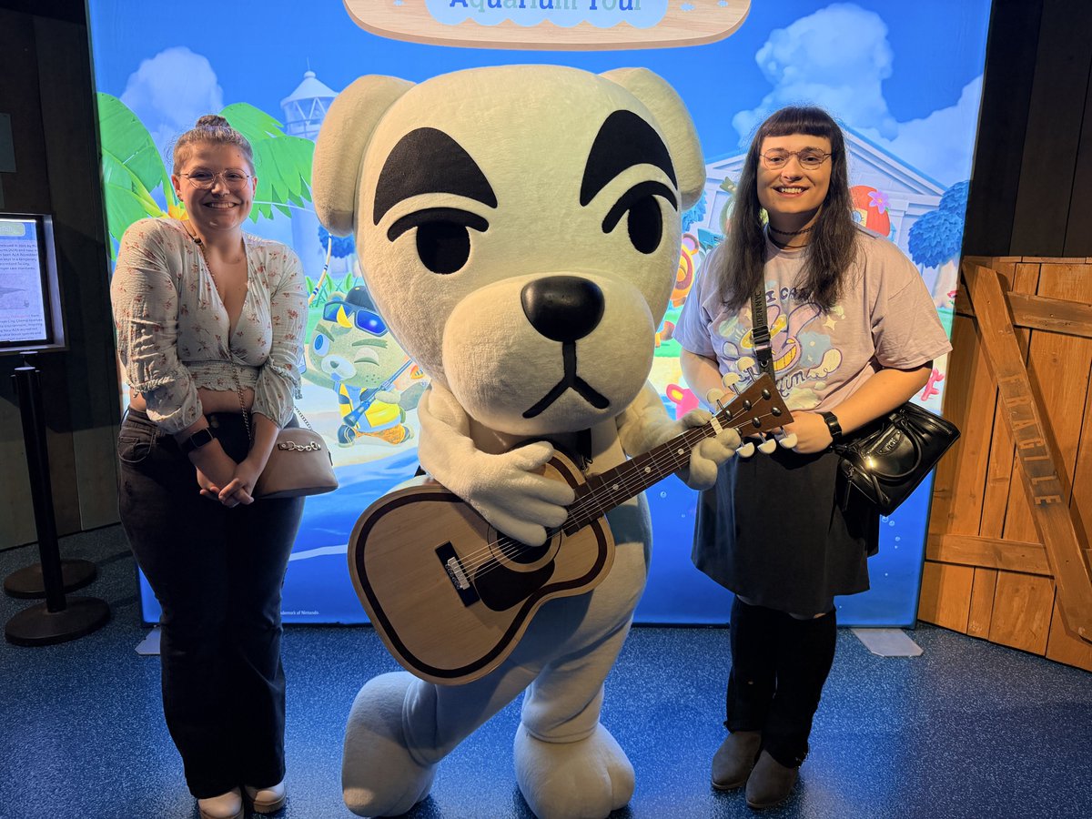 UnmedicatedPJs's tweet photo. Conservatives are FUMING that this beautiful transgender sapphic couple got to meet K.K. Slider at the Kansas City Sea Life Aquarium x Animal Crossing special Meet-and-Greet and they DIDN'T! https://t.co/98KrblFHNw