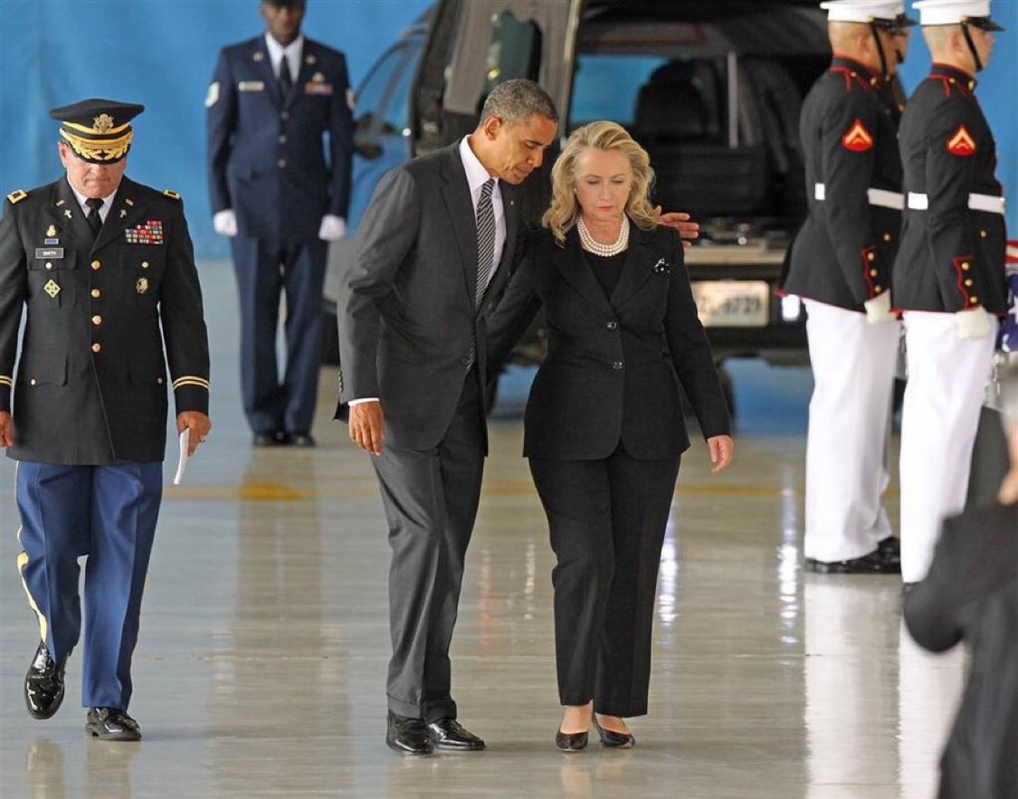 C_3C_3's tweet photo. NEVER FORGET:

This photo was taken after Hillary and Obama lied to the families of the 4 Americans they left to die in Benghazi by claiming a Youtube video caused a spontaneous uprising that led to the deaths of their loved ones.

Pure EVIL.

And the Media covered for them. https://t.co/2BBZ4olUvv