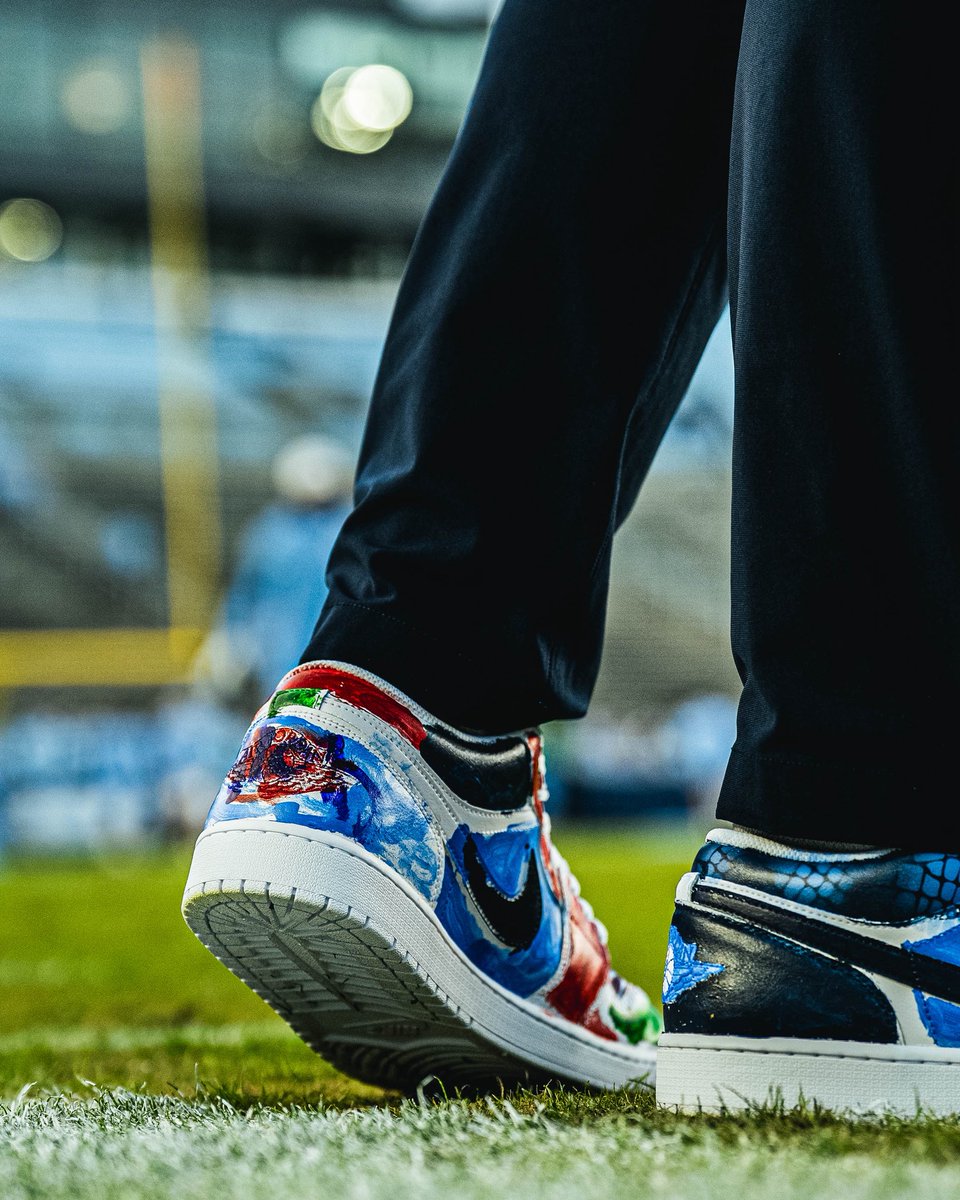 UNCFootball's tweet photo. Today our coaches are wearing Jordan’s painted by pediatric cancer patients at UNC Children’s Hospital 🩵 https://t.co/Dakq8tZu4b