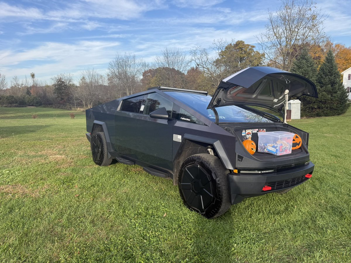 GrumpyTesla_'s tweet photo. "Trunk-or-treat? Nah, FRUNK-or-treat. 🎃⚡

Rolled the @cybertruck into our local Halloween event in Michigan and packed the frunk with Reese's, Jolly Ranchers, and a whole bin of chocolate. The line of little ghosts and witches stretched clear across the field.

Stainless steel on the outside, pure sugar on the inside. 👻🍫"

@Tesla